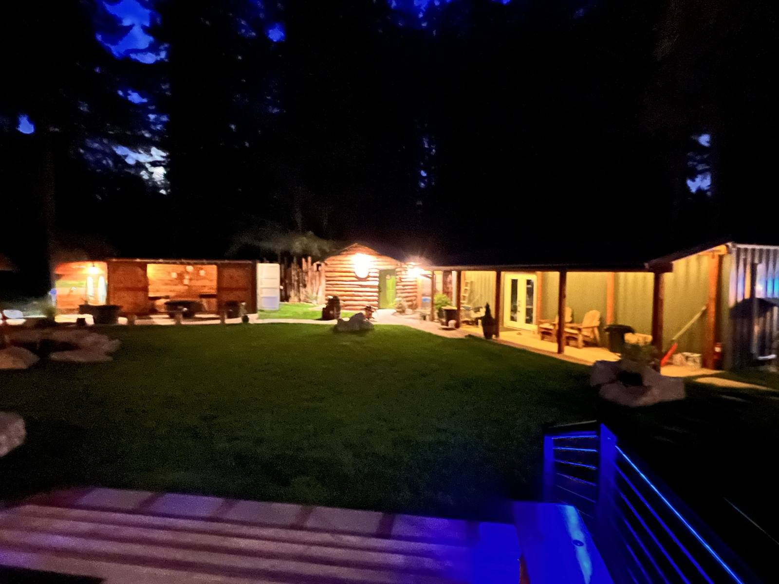 Night view across the lawn from the soaking-tub deck